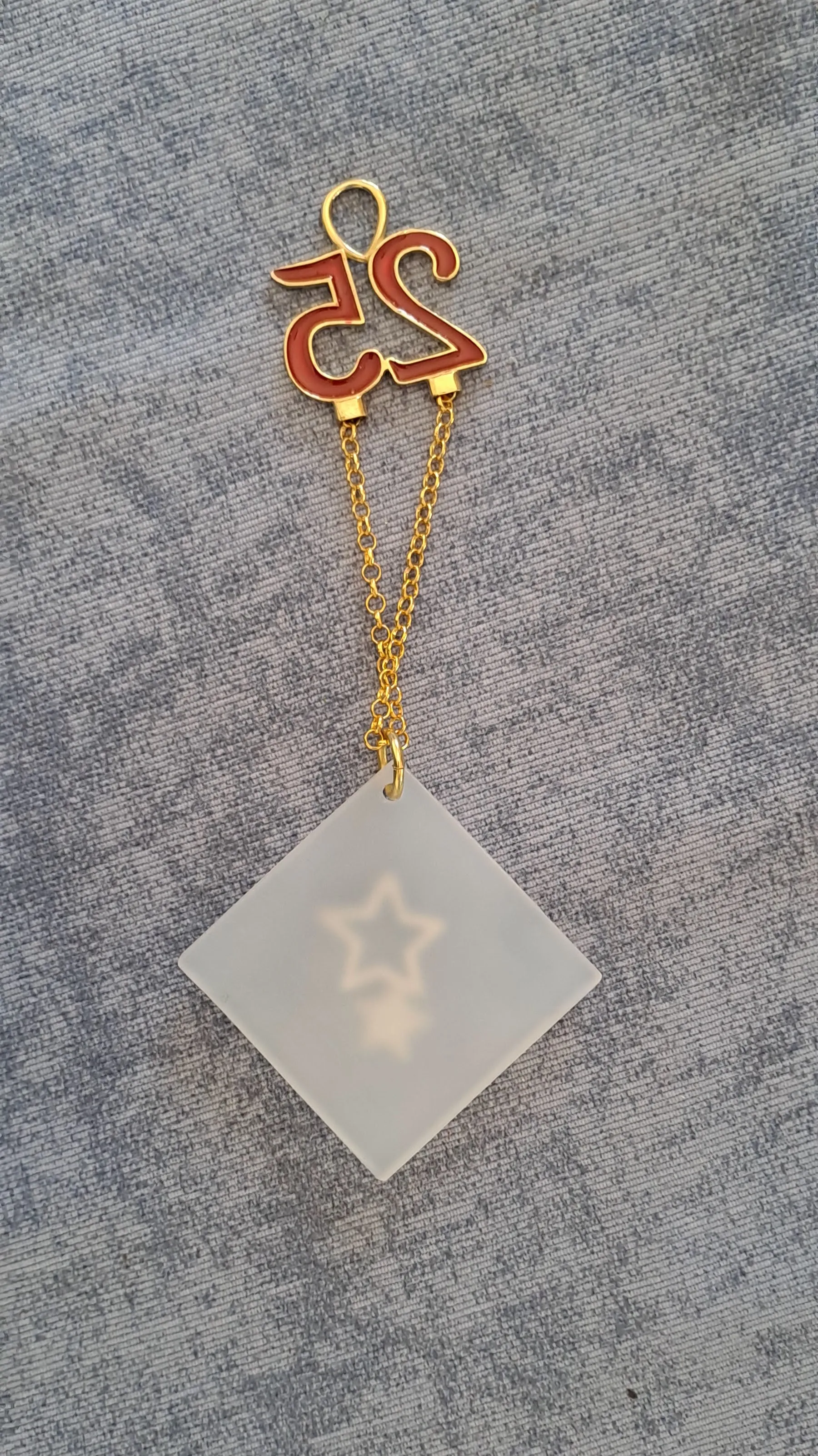 Sterling silver charm on Plexiglass - Star Charm